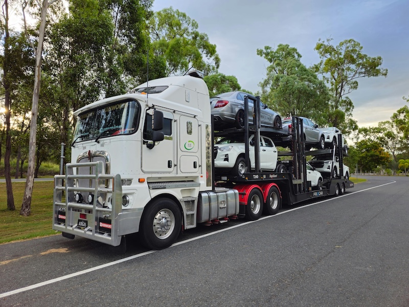 Car carrier truck on open road